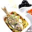 Дорада, запеченная с лимонным соком, петрушкой и сливочным маслом