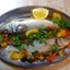 Сибас запеченный с овощами и лимоном