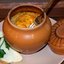 Тушеная курица с овощами в горшочках