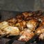 Куриные крылышки на шампурах на мангале в томатном маринаде