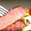 Бифштекс из отварного мяса с луком