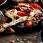 Шампиньоны с помидорами и чесночным маслом