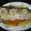 Рыба, запеченная с овoщами и лимоном