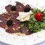 Карпаччо из северного оленя с козьим сыром и рукколой