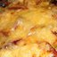 Свинина под овощами с сыром