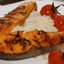 Стейк из семги на ложе из запеченных помидоров и рисовой лапши