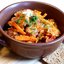 Горшочки с капустой, чечевицей и колбасками