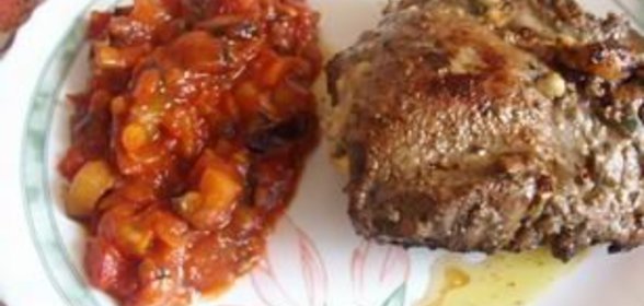 Мясо на косточке с начинкой из сыра, орехов и зелени